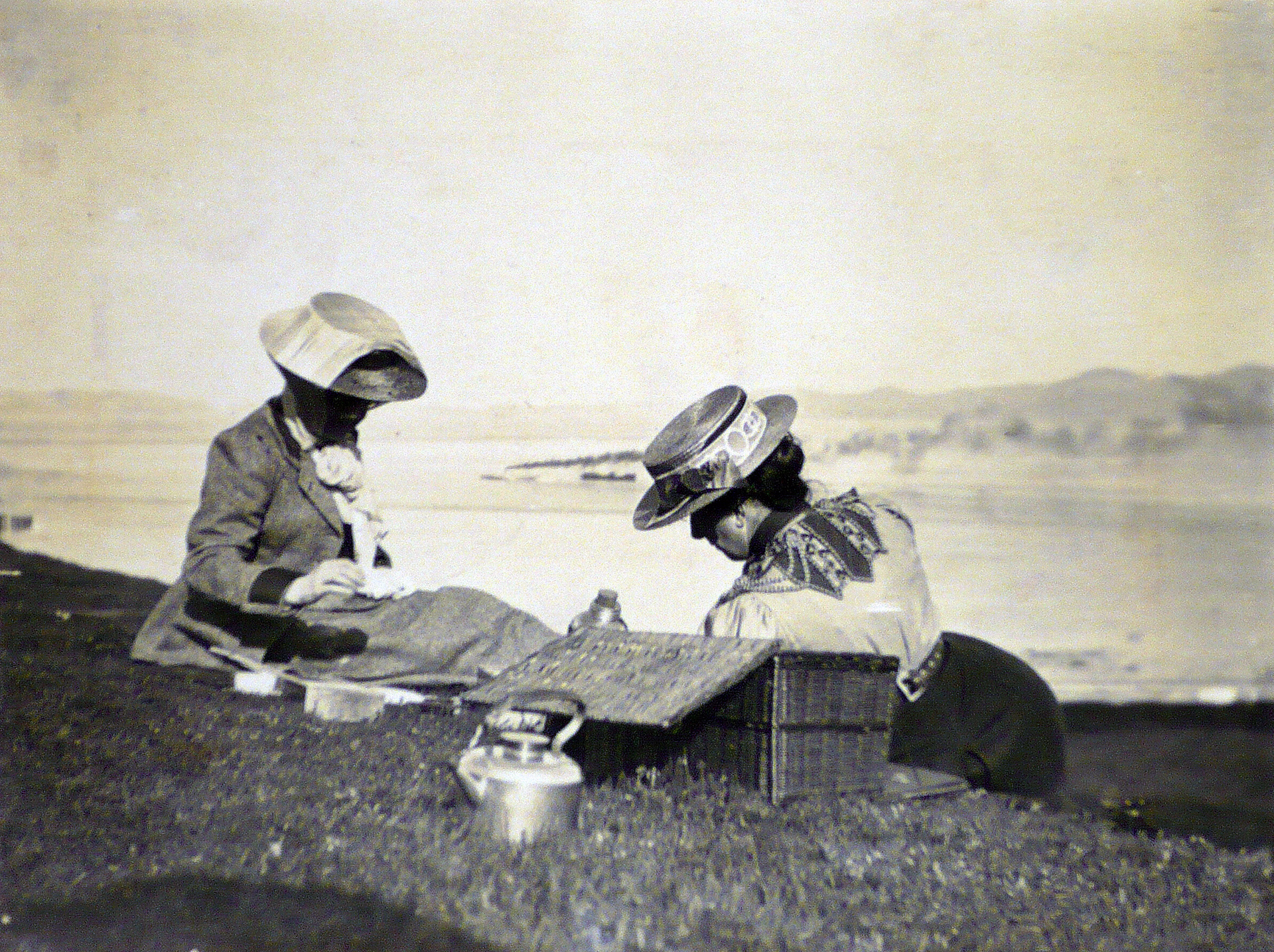 Black and white photograph of the sisters overlooking a landscape