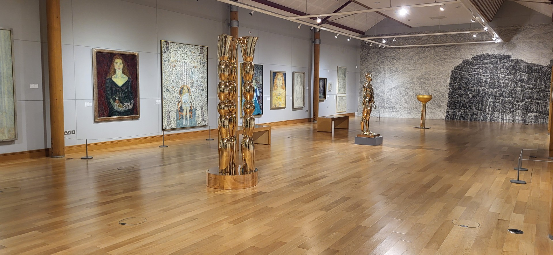 A photograph showing all three large sculptures as well as the large drawing of rock and sea, Anglesey